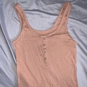Peach/beige colored crop top